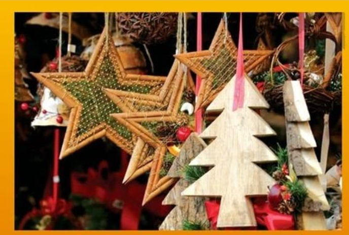Handmade holiday tree and star ornaments hanging from a tree.