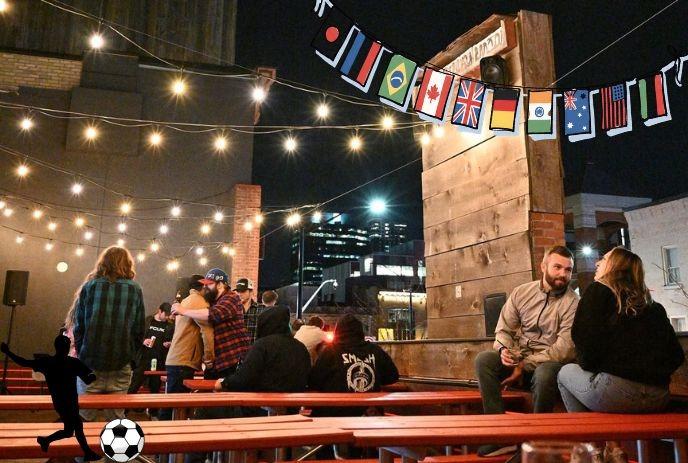 Night party with soccer World Cup theme at Tilt Arcade Bar Rooftop in London Ontario.