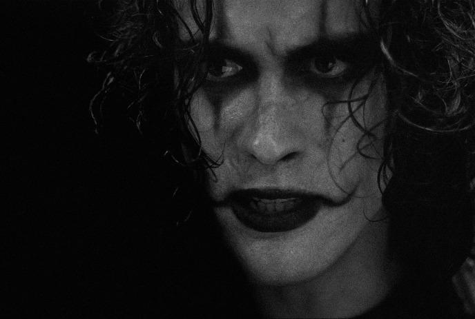 A sinister-looking person wearing scary makeup.