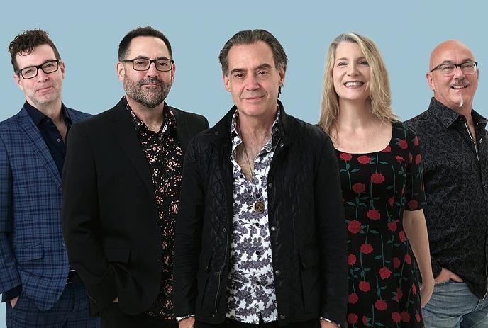 Group photo of the Canadian rock band Crash Test Dummies posing outdoors.