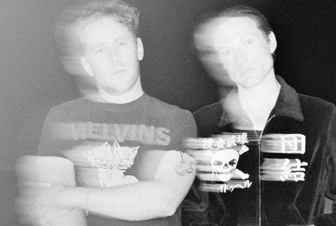 The Dirty Nil in a blurry black-and-white photo, wearing a