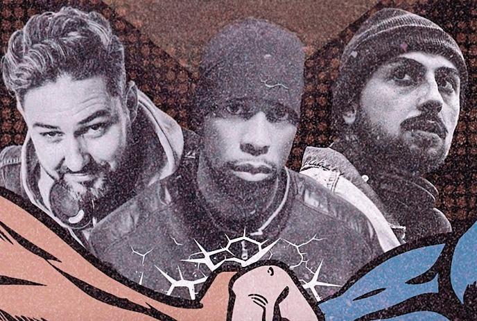 Three artists stand before a patterned backdrop in layered jackets and beanies in bold graphic style.