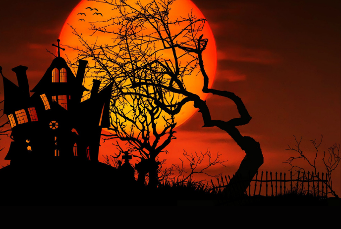 A spooky silhouette of a haunted house and twisted trees under a large orange moon.