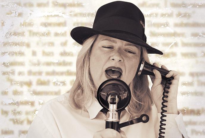 A woman in a hat sings into a vintage microphone with a newspaper background.