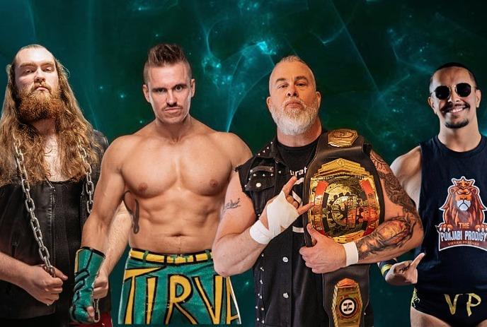 Four wrestlers pose in bold outfits, chains, belts, trunks, and attitude—against a moody green backdrop.