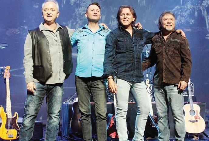 The band members of Hotel California: The Original Eagles Tribute, posing for the camera.
