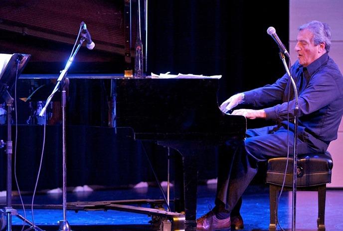 Jazz musician Charles Rallo playing the piano