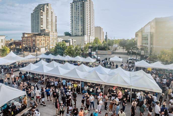 Crowded at Covent Garden Market with rows of white tents in a festival vibe.