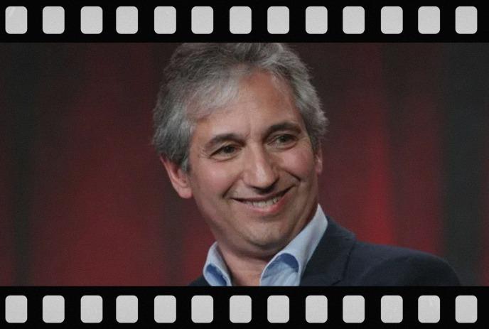 A picture of David Shore smiling, with a video film outlining the border.