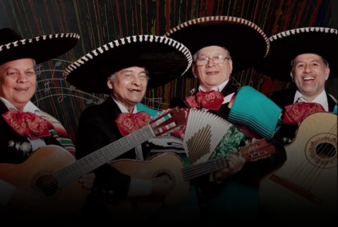Four mariachi musicians in black sombreros holding guitars and accordion against bright festive backdrop.