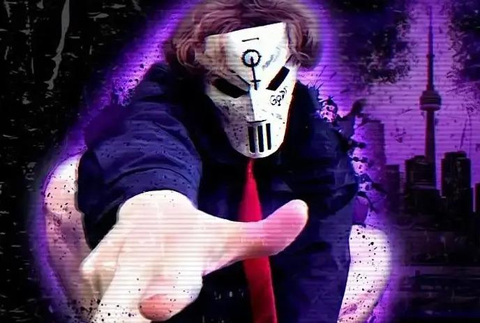 Lil Godd wearing a distressed white mask with black eye slits, hand-drawn symbols, and graffiti-style markings.