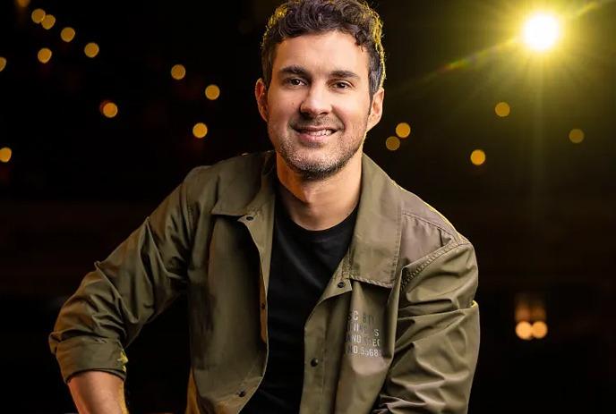 Comedian Mark Normand on stage