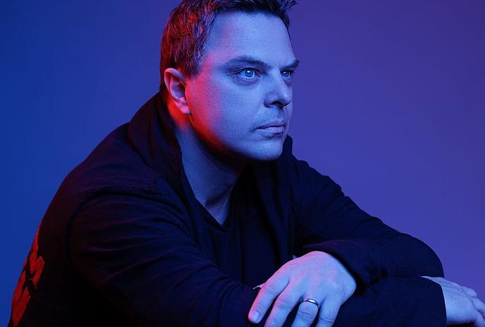 Markus Schulz  in a black leather jacket