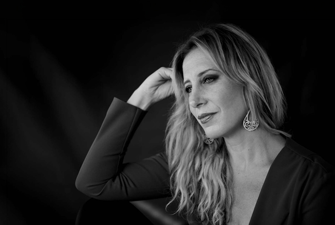 Black and white image of a person looking off into the distance.