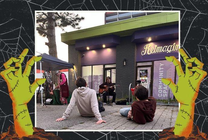Outdoor music show with seated musicians, Halloween border, and casual audience nearby.
