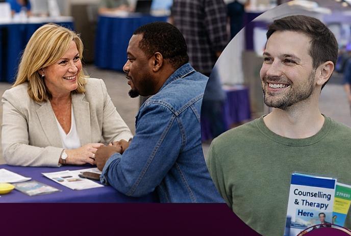 People chat and connect at an indoor event, gathered around tables and booths in a bright, welcoming space.