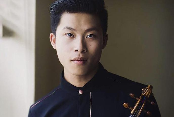 Kerson Leong looking straight ahead with a white background behind.