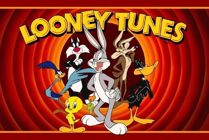 Bugs Bunny, Sylvester the Cat, Wile Coyote, Daffy Duck, the Road Runner and Tweety bird posing in front of a tunnel.