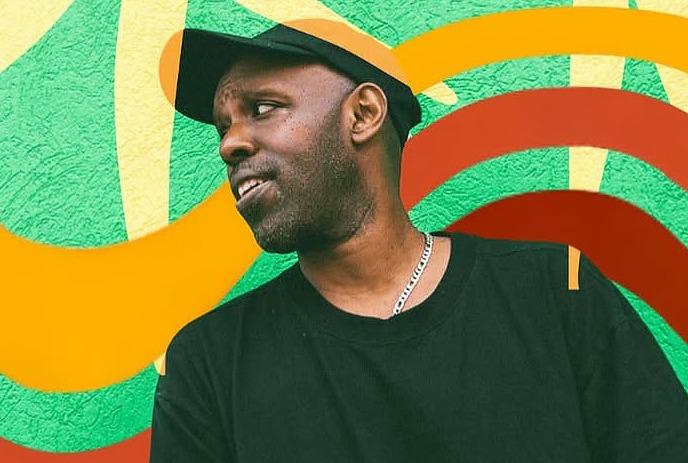 Musician SHAD against a colourful background.