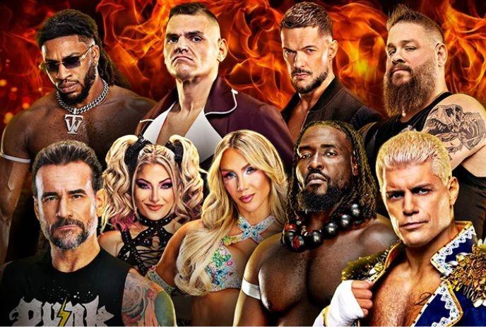 Nine wrestlers pose in fiery backdrop in the wrestling outfits.