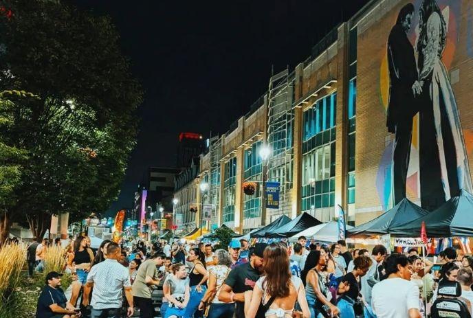 Crowds at Dundas Street with vendor tents and lively festival scene.