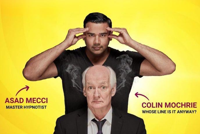 Two performers posing before yellow backdrop one making hypnotic gesture behind other with comic steam effect.
