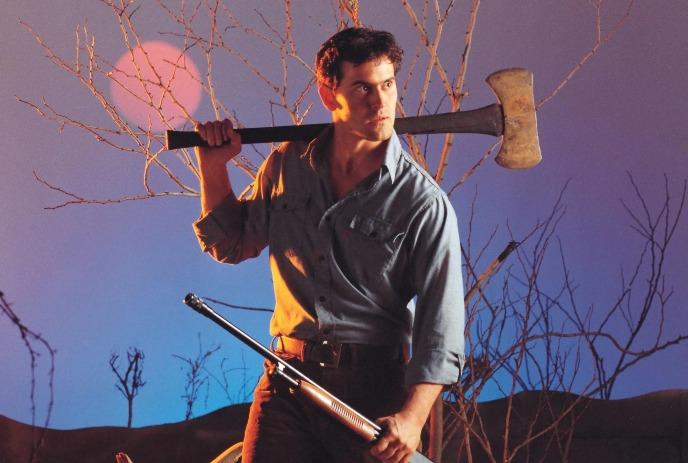 Man in barren land, axe on shoulder, shotgun in hand, red sun behind, in a survival vibe.