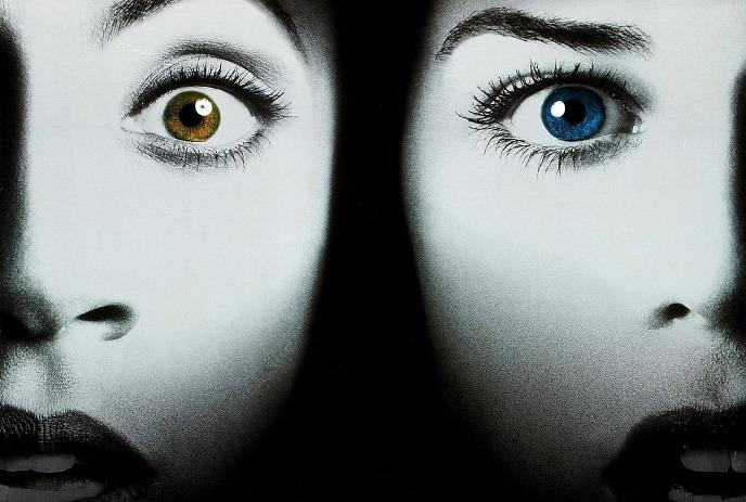 One half face with a brown eye and one half face with a blue eye.
