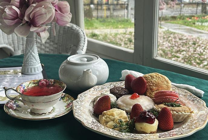 Squares and tea on a table by the window.