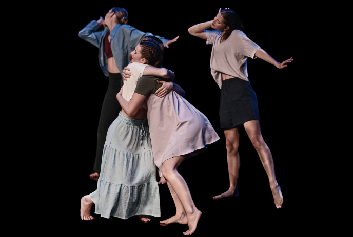 Four dancers moving expressively on dark stage with fluid poses and close interaction creating emotional motion.