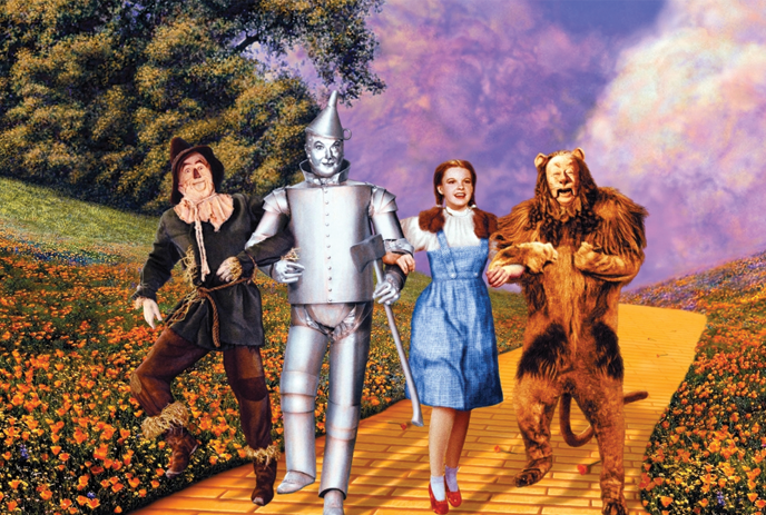 Dorothy, Scarecrow, Tin Man and the Cowardly Lion walking along the yellow brick road.