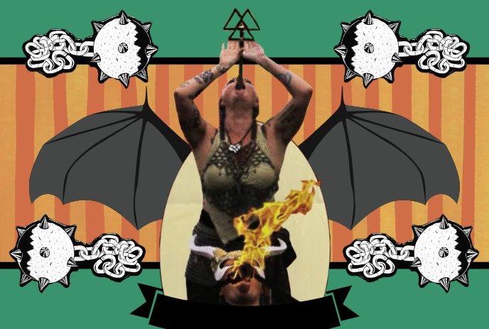 A woman performs a fire-eating act, balancing a triangle on her lips.