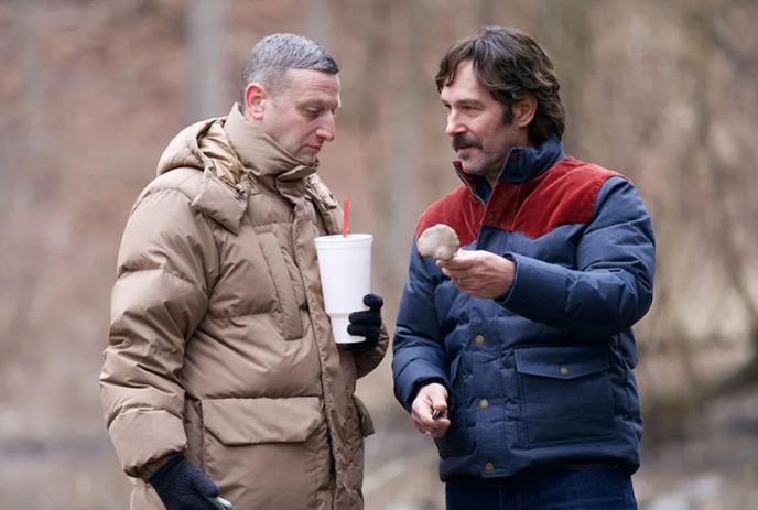 Two people wearing winter jackets in deep conversation with each other.
