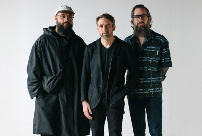 Three members of the Joe Policastro Trio posing for a group photo.