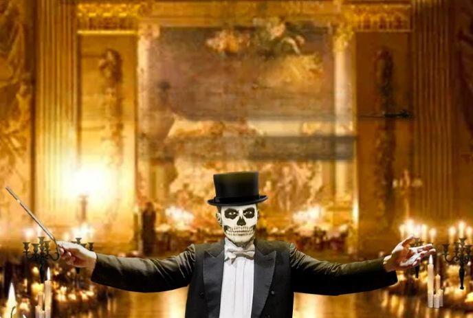 A skull-faced conductor in a tuxedo and top hat poses theatrically in a lavish, golden-lit ballroom.