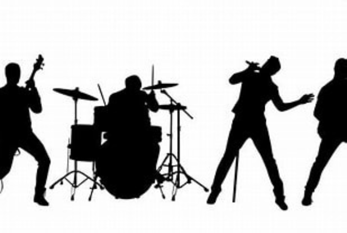 Silhouette of a rock band playing on stage.