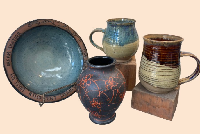 Samples of pottery that may be for sale: mugs, bowls and urns.