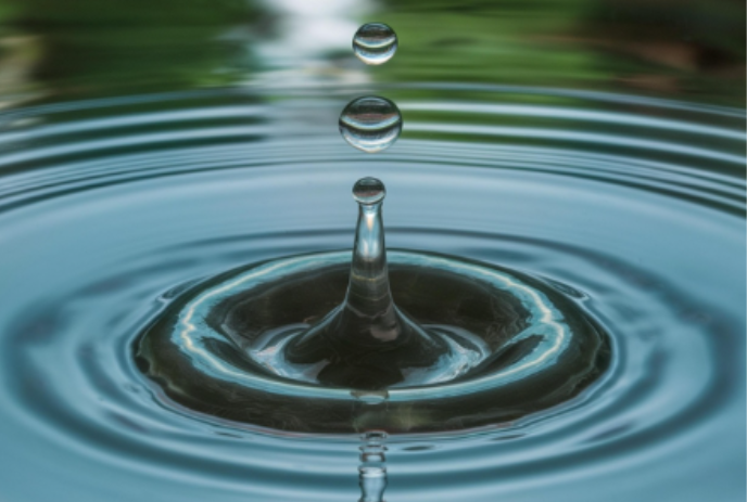 Droplets of water creating ripples.