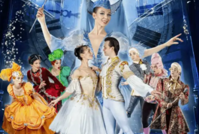 A ballet company on stage with the Fairy Godmother overlooking them