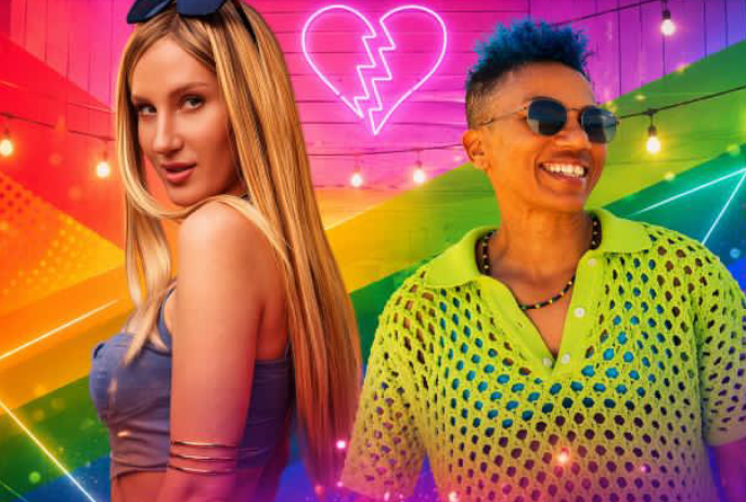 Two performers standing in front of a colourful backdrop with lights.