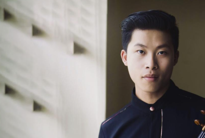 Kerson Leong looking straight ahead with a white background behind.