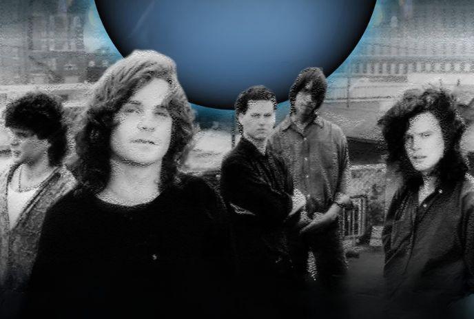 Five artists stand outdoors beneath a glowing blue orb in a gritty urban setting background structures loom around them.