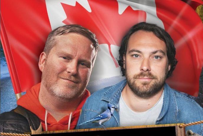 Two comedians before large Canadian flag smiling for a picture.