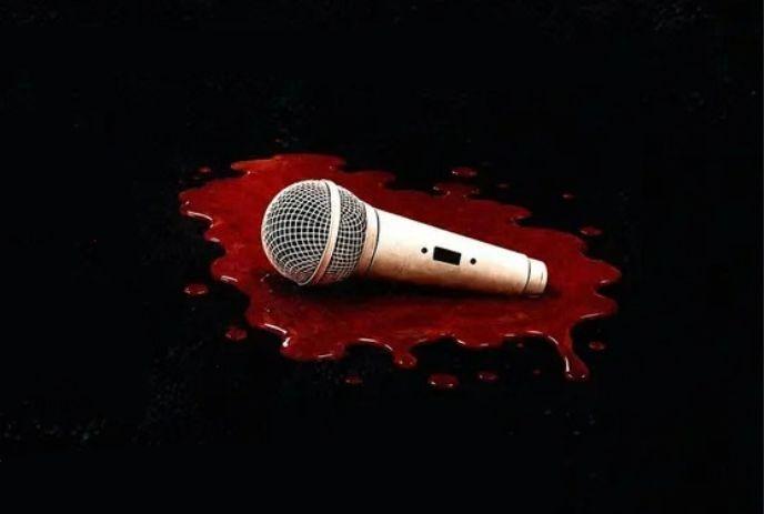 Microphone lying in a pool of red liquid on a dark surface, symbolizing silenced speech and loss.