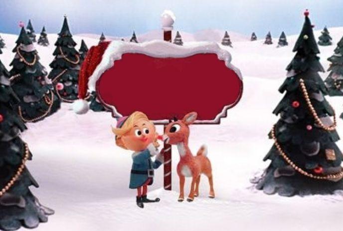 Animated elf and reindeer beside a blank red holiday sign in a snowy forest with decorated trees.