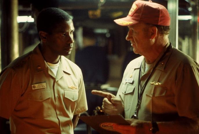 Two people in uniforms having a deep discussion.