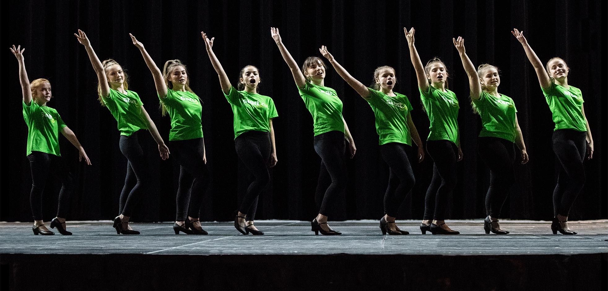 Young girls performing a dance on stage at Budweiser Gardens in London, Ontario