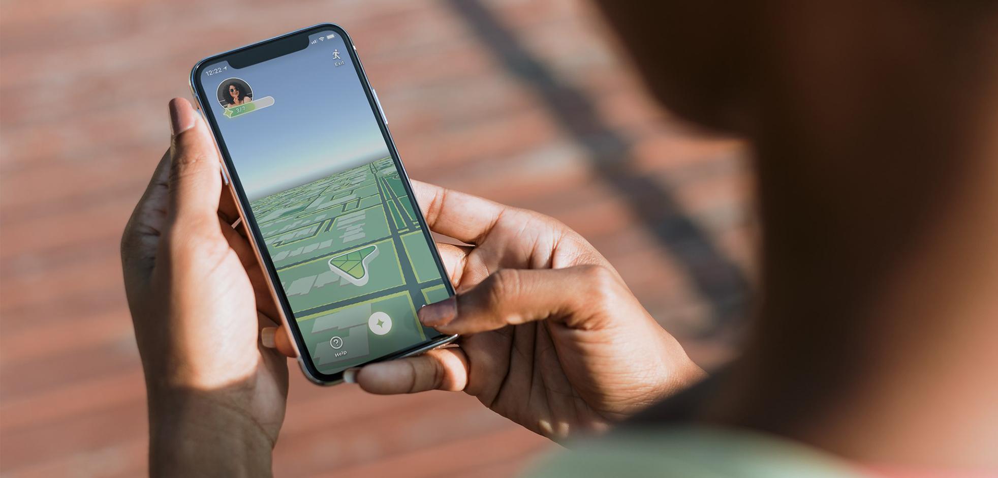 hand holding phone showcasing app