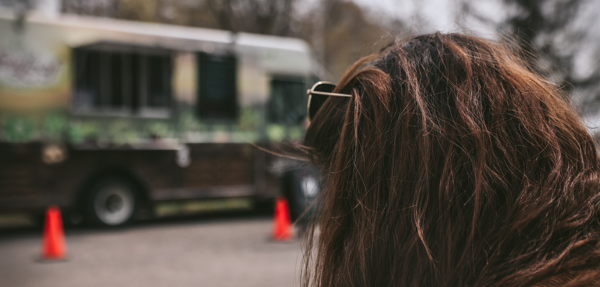woman waiting for food at a local London, ontario food truck