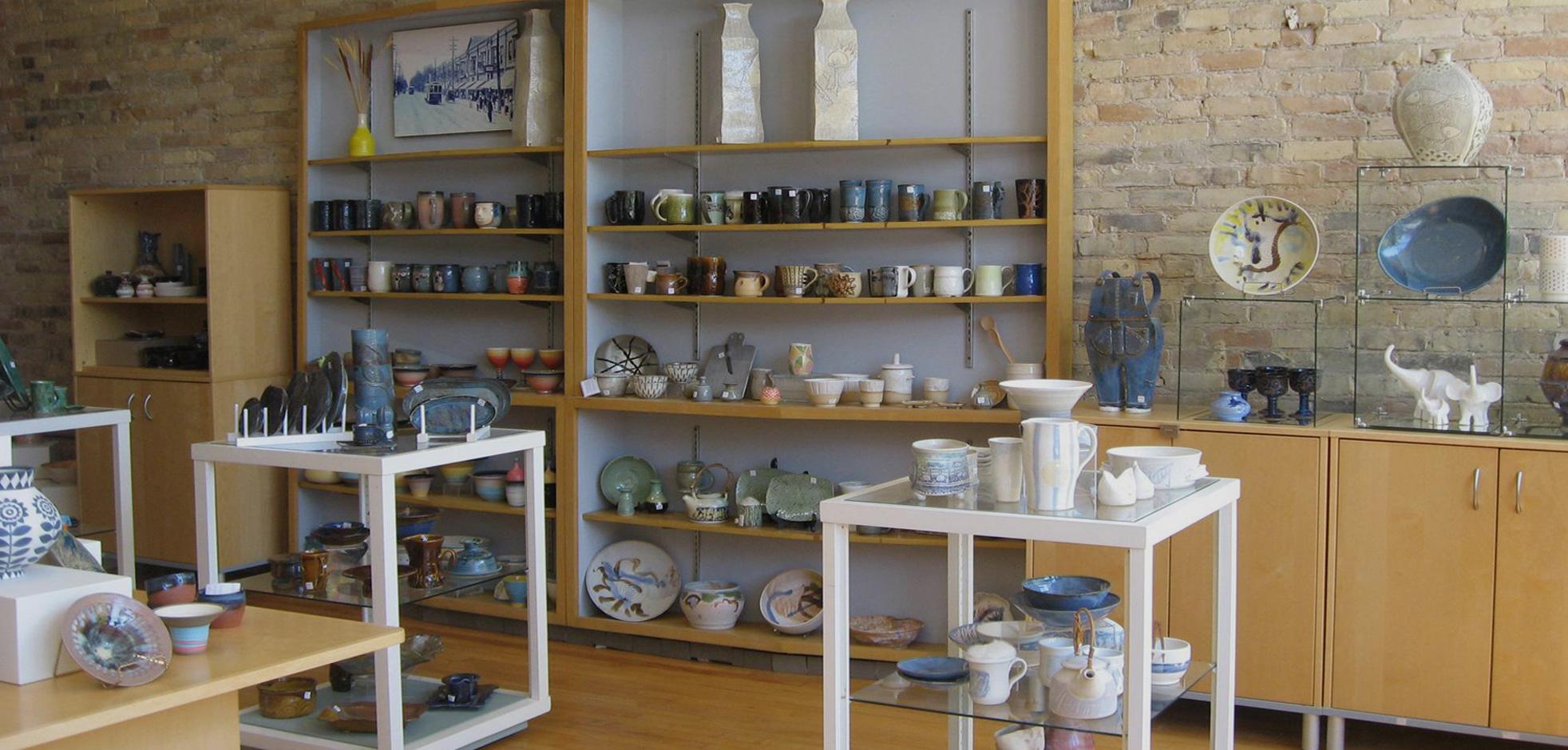 Shelves of various types of pottery on display at the London Clay Art Centre located in London, Ontario, Canada.